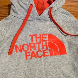 The North Face Gray Hoodie with Vibrant Red Accents
